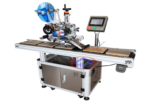 貼標機的覆標機構的作用是什么？